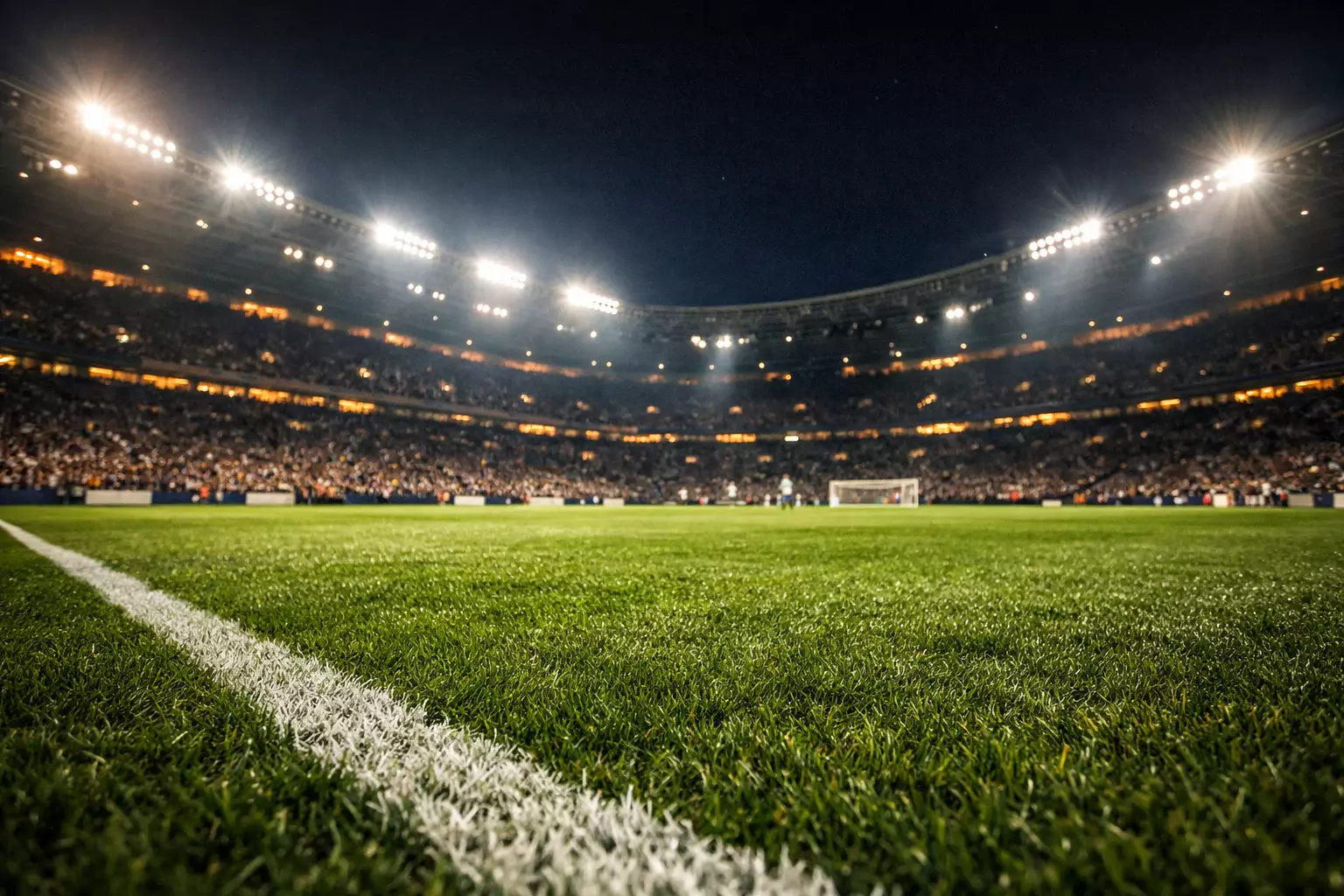 Stadio di calcio illuminato durante una partita serale